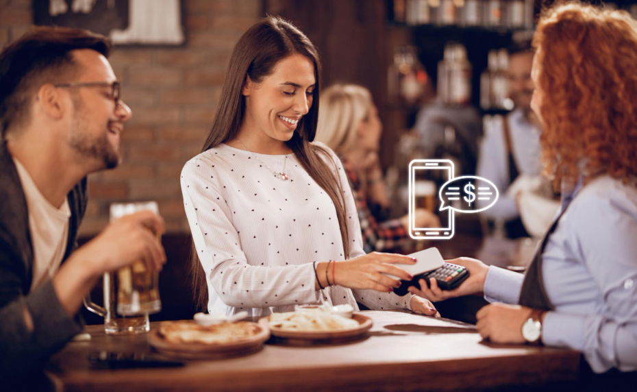 Woman using tap-to-pay with smartphone on POS waitress holds